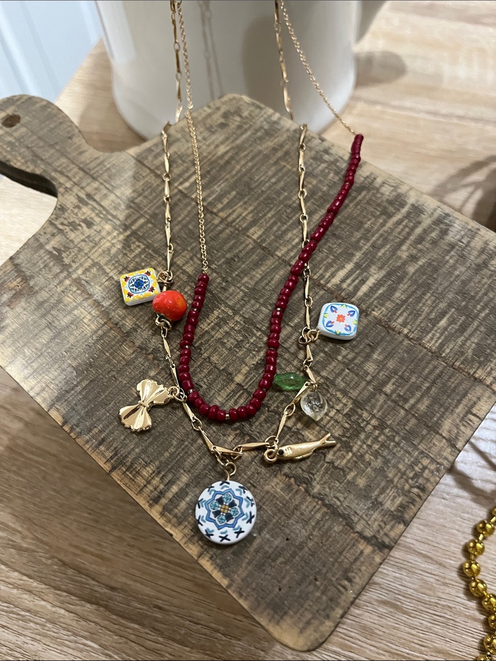 2 Gold-Tone Layered Necklaces with Red Beaded Strand and Ceramic Charms